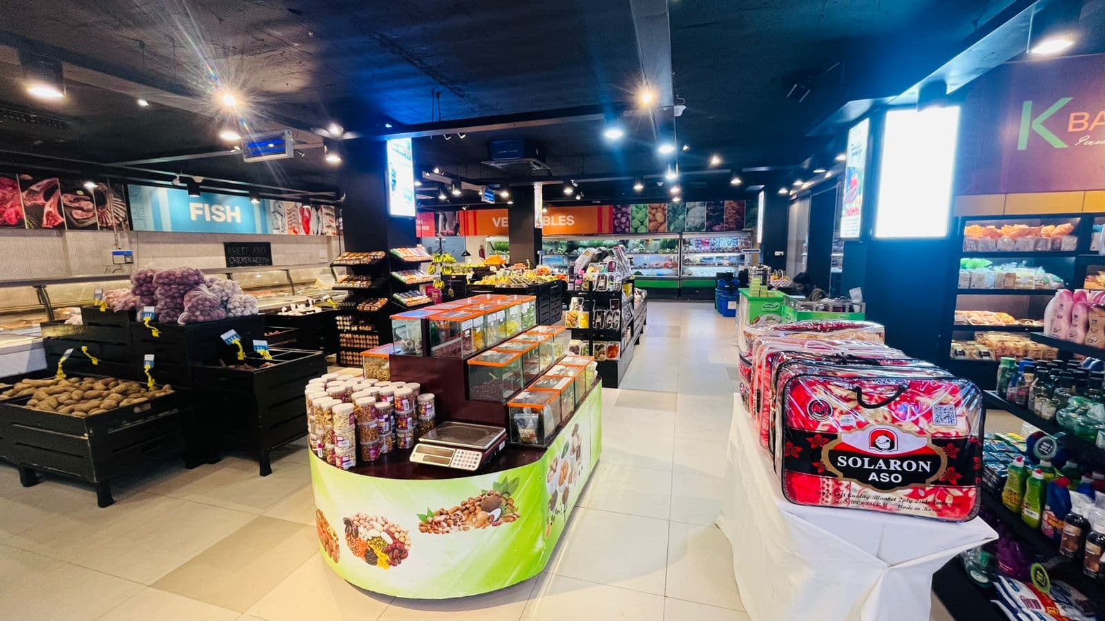 The fresh produce and fish counters on the Khulshi Mart shop floor