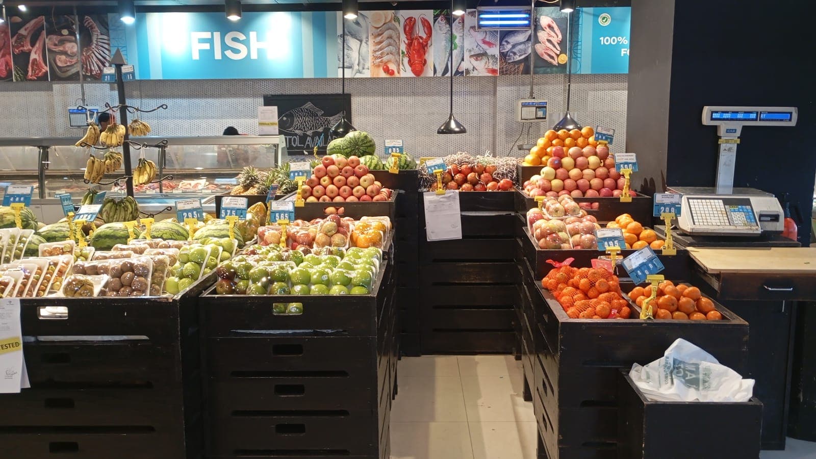 Fruit crates in front of the Khulshi Mart fish counter